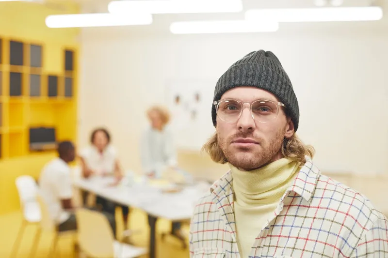 The New Corner Office Flex: Why Bold Headwear Is Taking Over Creative Workplaces
